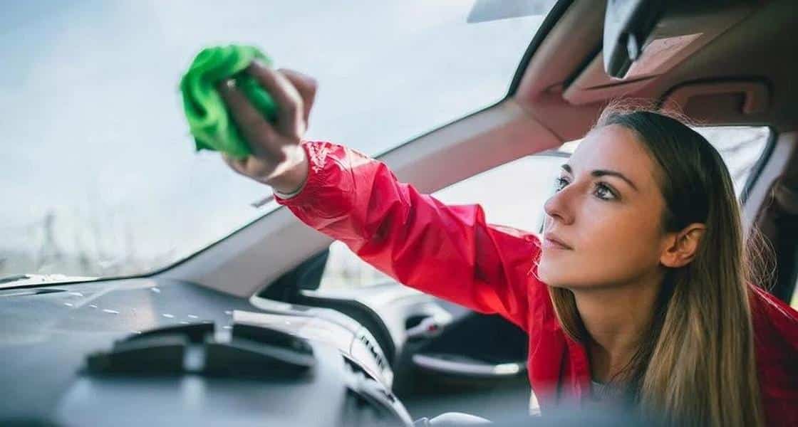 Windshield cleaning A person cleans the windshield
